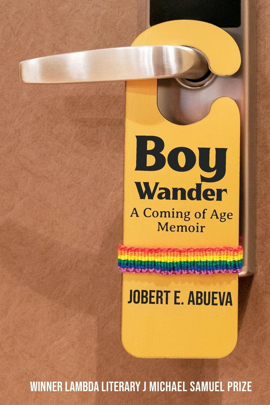 Cover of the nonfiction book "Boy Wander: A Coming of Age Memoir" by Jobert E. Abueva. The cover depicts a close-up image of a door handle with a sign hanging onto it. The sign includes the title, subtitle, and author name, and a rainbow sweatband is stretched around it.